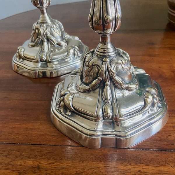 close-up of a pair of silvered bronze candlesticks