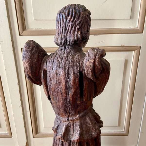 the back of a carved Oak Angel