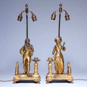 A pair of aged French lamps